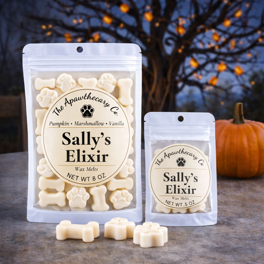 Two packages of 'Sally's Elixir' wax melts with a pumpkin and tree in the background.