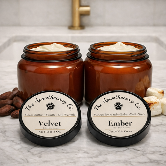 Two jars of skincare cream with labels on a marble surface