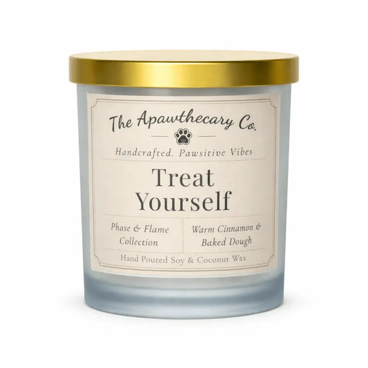 Candle with a gold lid and 'The Apawthecary Co' label on a white background