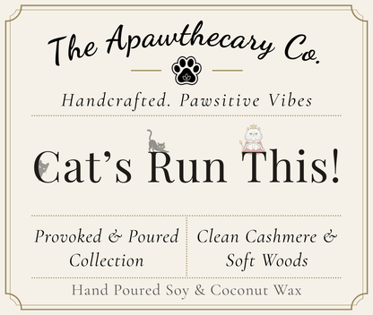 Product label for 'Cat's Run This!' from The Apawthecary Co. with cat illustrations and text about handcrafted candles.