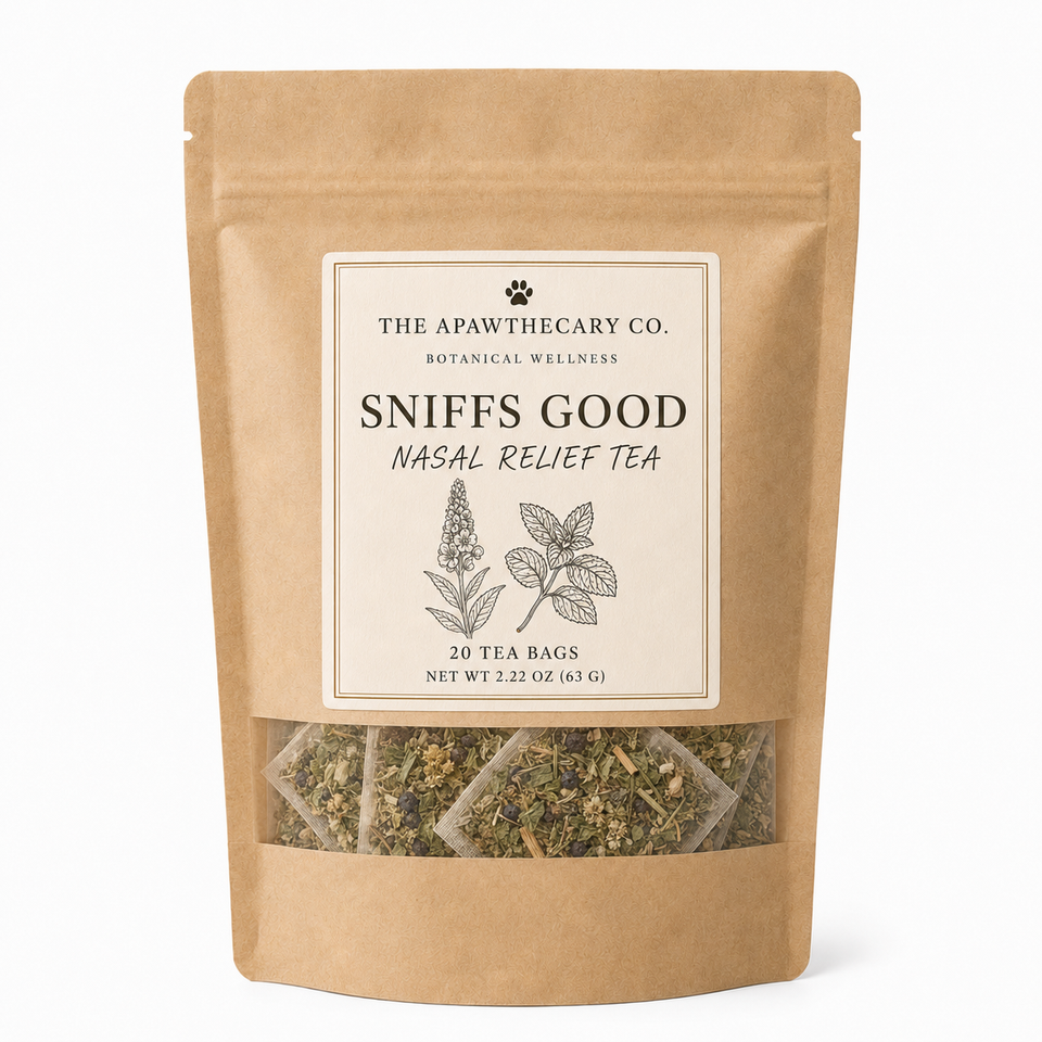 A stand-up kraft paper pouch of The Apawthecary Co. Sniffs Good Nasal Relief Tea, with a cream label and a clear window showing the herbal tea bags inside, on a white background.