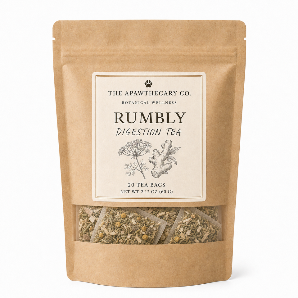A stand-up kraft paper pouch of The Apawthecary Co. Rumbly Digestion Tea, showing the tea bags through a clear window at the bottom against a white background.