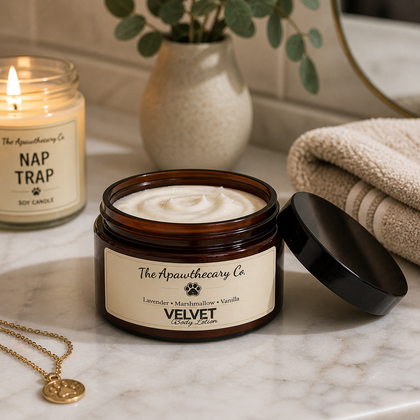 Velvet & Ember - Body Lotion – Lightweight Moisturizer for Dry Skin in an amber jar with candle and towel in a bathroom setting.