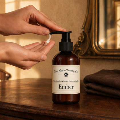 Person dispensing Ember lotion into their palm beside the amber pump bottle.