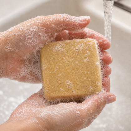 Golden Oat & Honey - Luxury Cold Process Soap - Natural Oat & Honey bar being held in soapy hands.