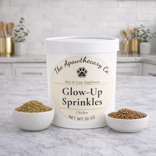 Container of 'Glow-Up Sprinkles' by The Apawthecary Co. on a kitchen counter.