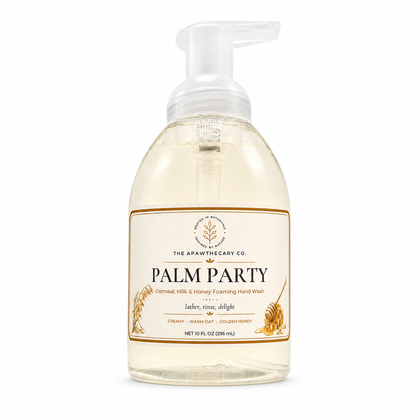 A 10 fl oz bottle of The Apawthecary Co. Palm Party foaming hand wash, featuring a clear bottle with a white pump dispenser and a cream-colored label with gold accents.