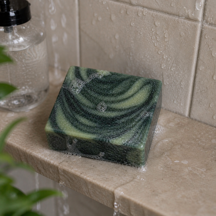 Like A Boss - Luxury Cold Process Soap – Masculine Scented resting on a wet stone surface with bubbles.