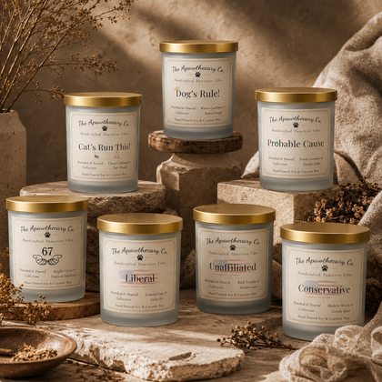 Collection of candles from The Apothecary Co with various names on a rustic background.