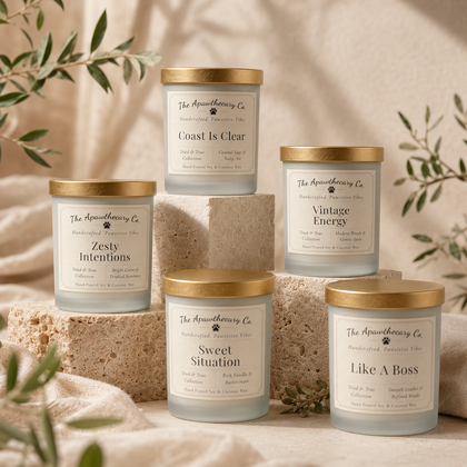 Set of candles with gold lids on a neutral background