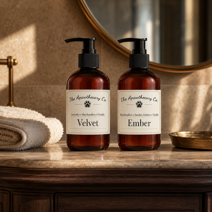 Velvet and Ember lotion pump bottles on a stone bathroom counter.