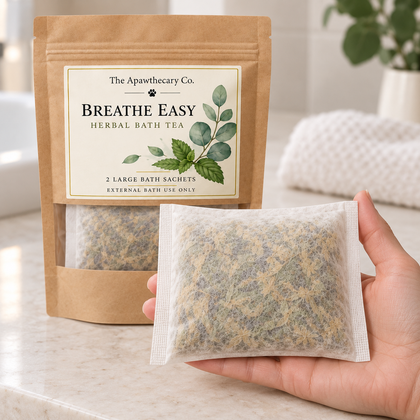 Breathe Easy herbal bath tea in kraft window pouch with large bath sachet, shown in hand