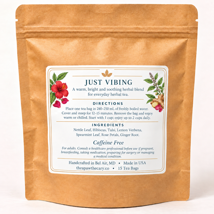 Just Vibing back label with hibiscus, rose, tulsi and ginger artwork; approved seven-herb ingredients, directions, cautions and 15 tea bags.