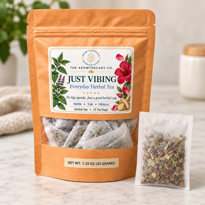 Just Vibing – Everyday Herbal Tea — One sealed filled tea bag beside Just Vibing pouch. Confirm bag dimensions and fill appearance from a real sample.