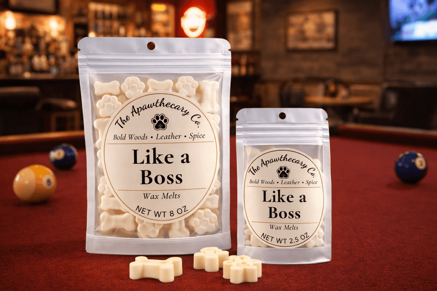 Signature soy & coconut wax melts packaging labeled 'Like a Boss' displayed on a billiards table.