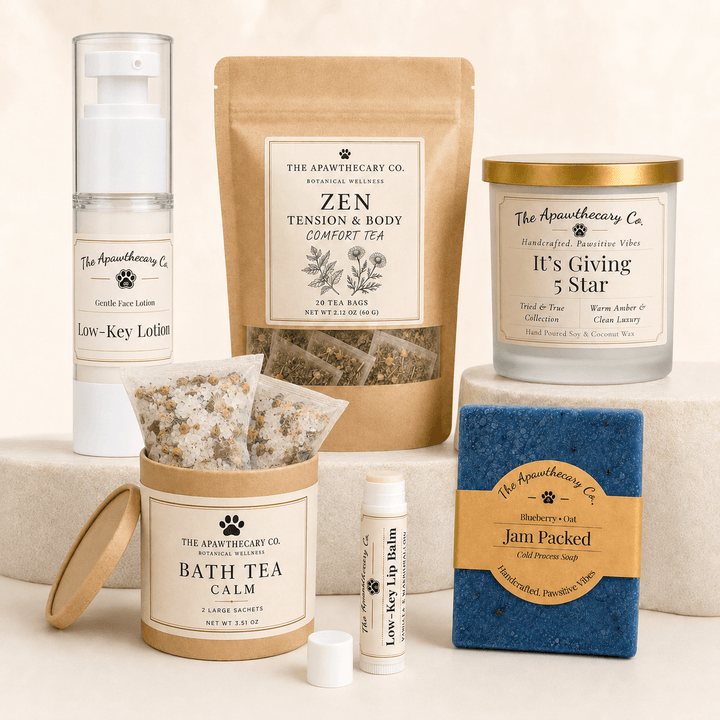 The Full Tour bundle with lotion, lip balm, soap, candle, herbal tea, and two Epsom-salt-and-botanical Bath Tea Calm sachets.