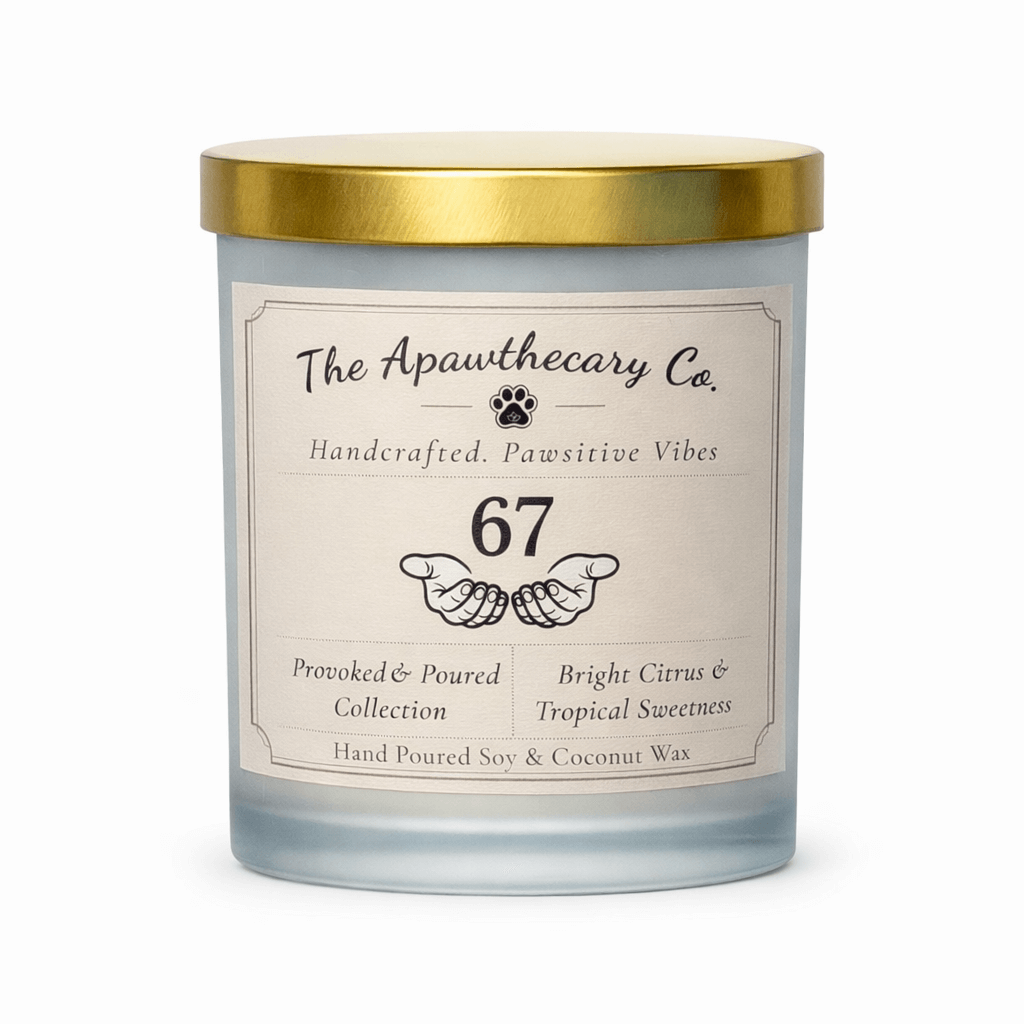 Candle with a gold lid and label from The Apawthecary Co. on a white background