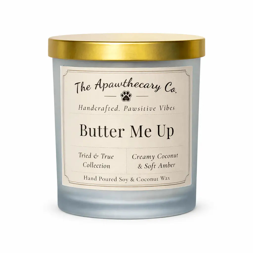Candle with a gold lid and 'The Apawthecary Co.' label on a white background