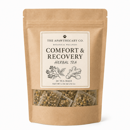 A stand-up kraft paper pouch of The Apawthecary Co. Comfort & Recovery Herbal Tea, featuring a cream label with botanical illustrations and a clear window at the bottom showing the herbal tea bags inside.
