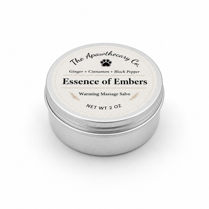 Closed 2 oz tin of Essence of Embers warming massage salve on a white background.