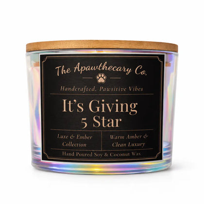 Candle with a label from The Apothecary Co. on a white background