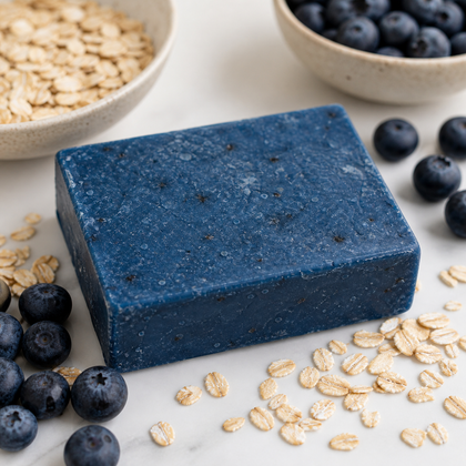 Jam Packed - Standard Cold Process Soap - Blueberry Scented with blueberries and oats on a marble surface.
