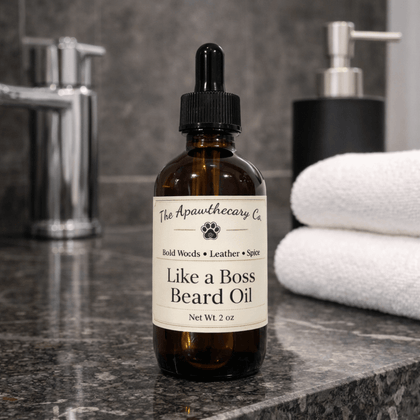Bottle of 'Like a Boss Beard Oil' by The Apawthecary Co. on a bathroom counter.