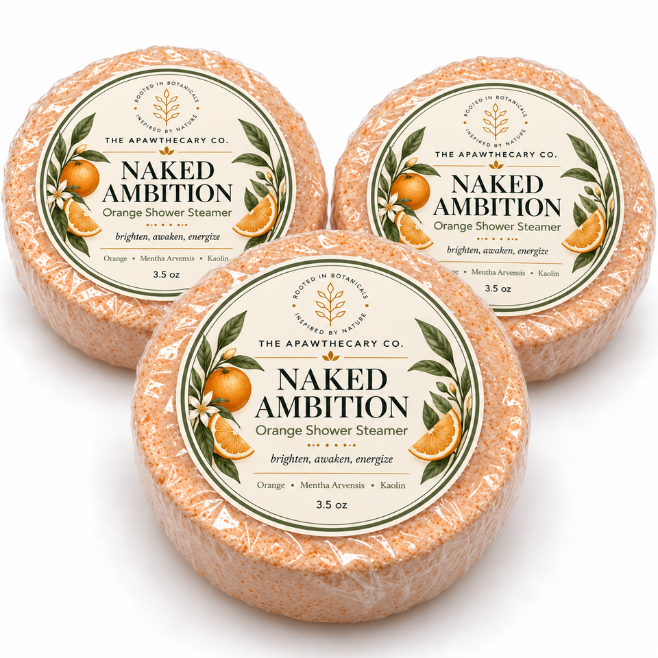 Naked Ambition orange shower steamer individually wrapped with label on white background