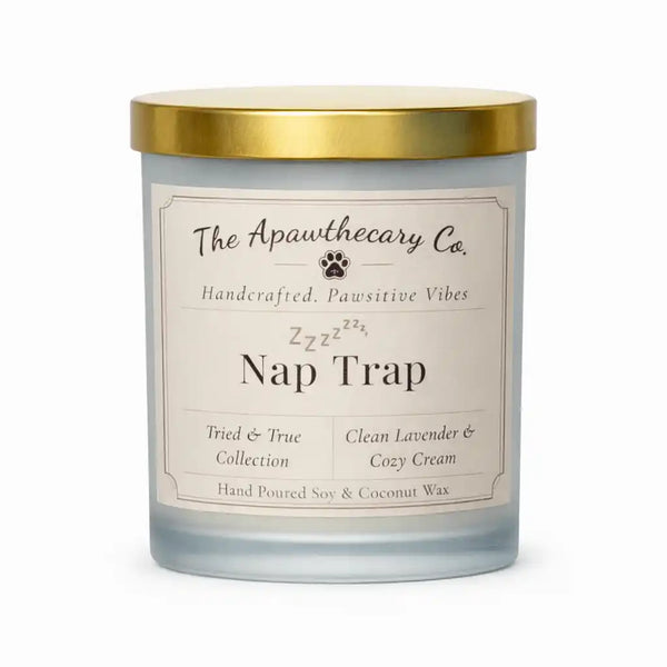 Candle labeled 'Nap Trap' from The Apawthecary Co. on a white background
