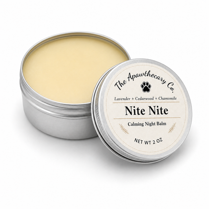 Open 2 oz tin of Nite Nite aromatic night balm with its labeled lid beside it.