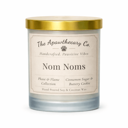 Candle with gold lid and label on a white background