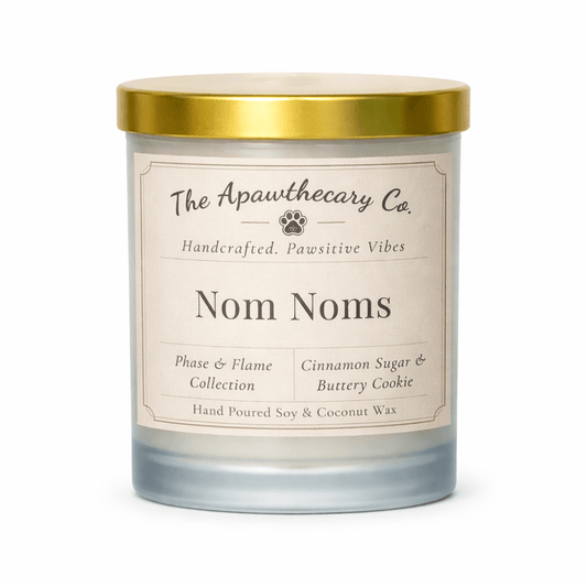 Candle with gold lid and label on a white background