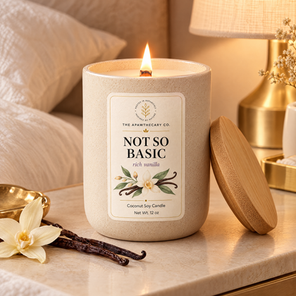 Not So Basic candle in a cozy cream bedroom