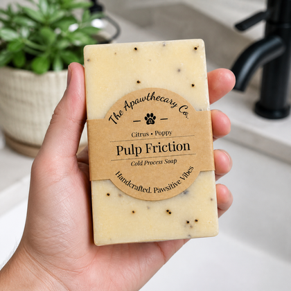 Pulp Friction - Standard Cold Process Soap - Exfoliating Citrus & Poppy held in hand with natural background.
