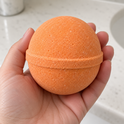 Rest in Fizz unwrapped bath bomb — matte powder texture shown in hand