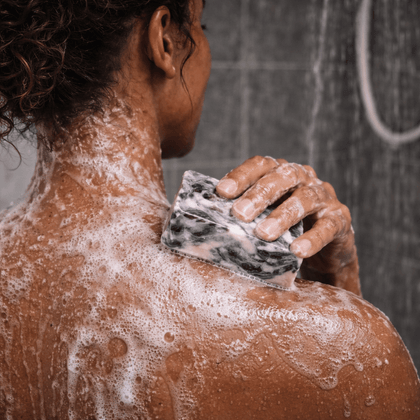 Applying Stormy Nights Cold Process Soap – Calming Soap during a relaxing shower with rich lather.