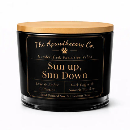 Candle with a wooden lid and black label featuring 'The Apawthecary Co.'