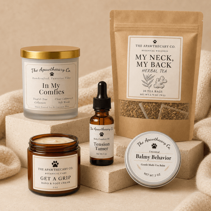 The Long Day Reset bundle with candle, herbal tea, massage oil, hand and foot cream, and barrier balm.