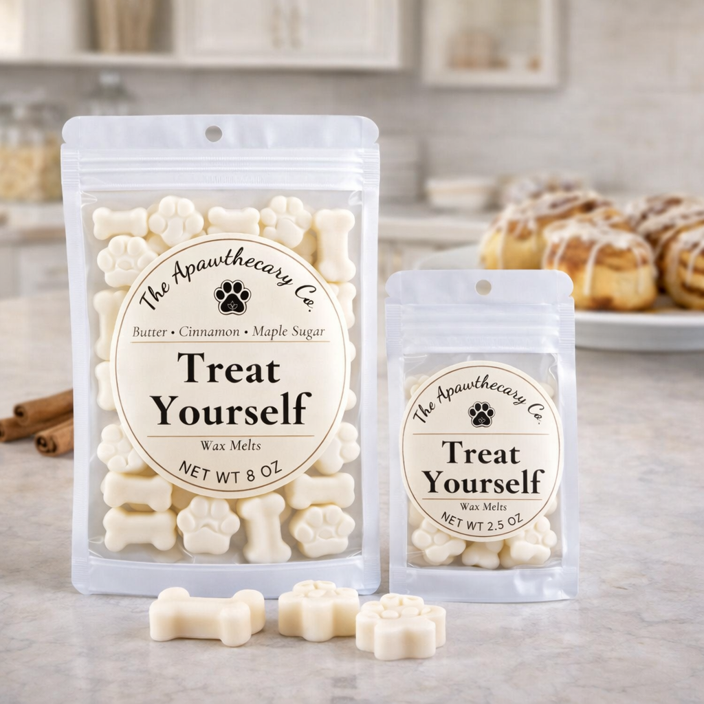 Two packages of 'Treat Yourself' wax melts from The Apawthecary Co. on a kitchen counter.